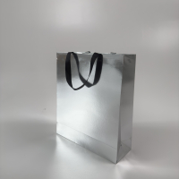 Пакет паперовий 35*40*12 см срібний фольгований, з стрічкою